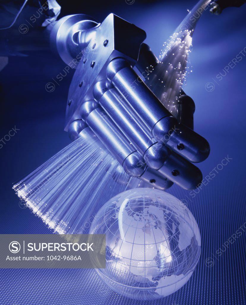 Stock Photo: 1042-9686A Robotic arm holding fiber optics cables
