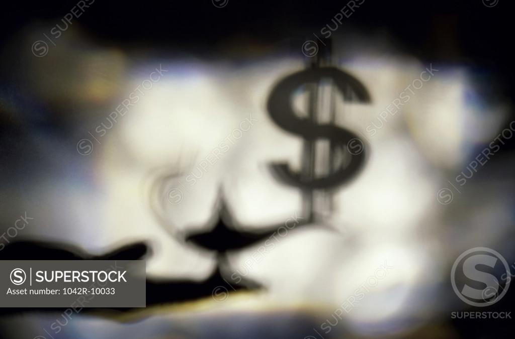 Stock Photo: 1042R-10033 Silhouette of a magic lamp and a dollar sign