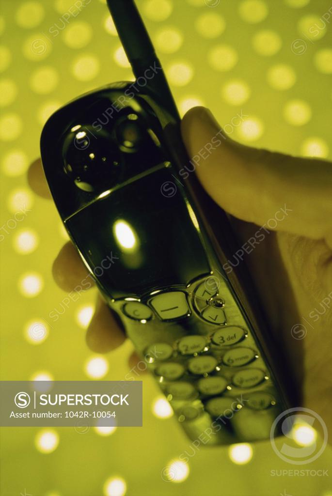 Stock Photo: 1042R-10054 Person holding a mobile phone