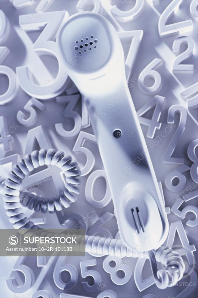 Stock Photo: 1042R-10113B Telephone receiver on numbers