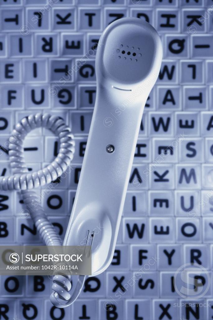 Stock Photo: 1042R-10114A Telephone receiver on alphabets