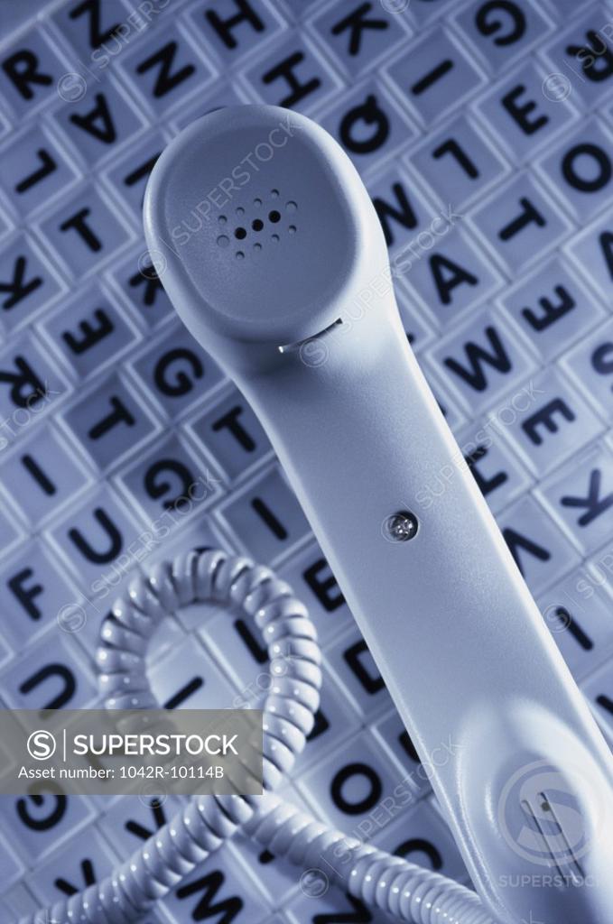 Stock Photo: 1042R-10114B Telephone receiver on alphabets