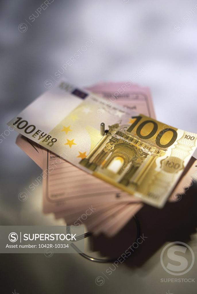 Stock Photo: 1042R-10334 Euro banknotes on memo paper