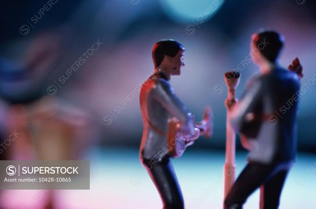 Stock Photo: 1042R-10865 Toy model of two men playing guitars