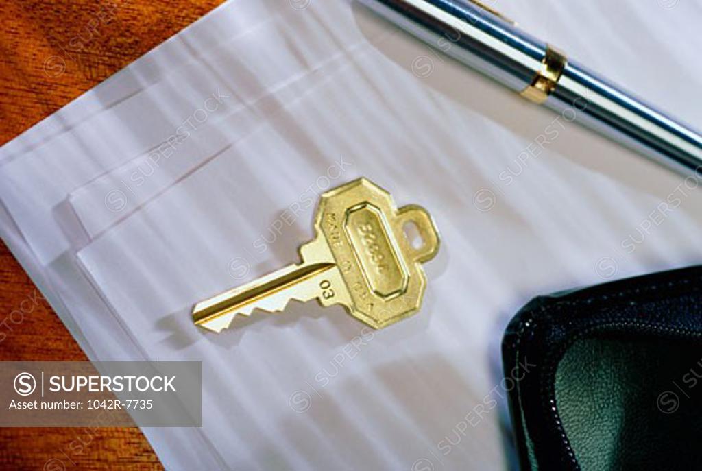 Stock Photo: 1042R-7735 Close-up of a key on sheets of paper