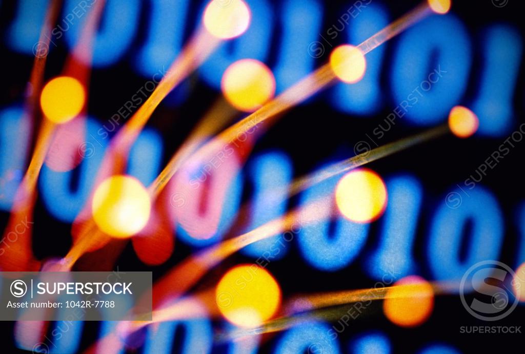 Stock Photo: 1042R-7788 Fiber optics with binary code in the back ground