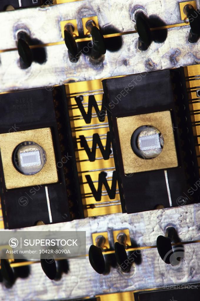 Stock Photo: 1042R-8090A WWW on a component of a circuit board