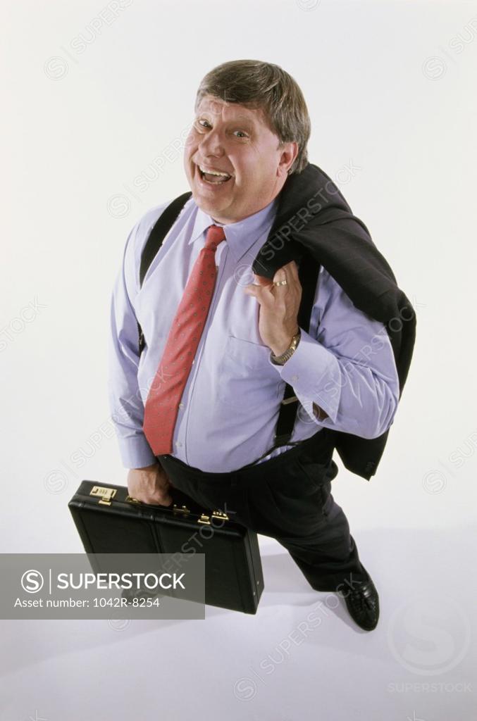 Stock Photo: 1042R-8254 Portrait of a businessman holding a coat and a briefcase
