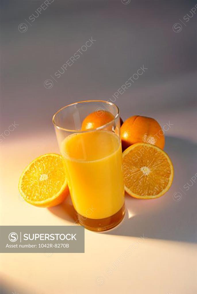 Stock Photo: 1042R-8270B Glass of orange juice and oranges