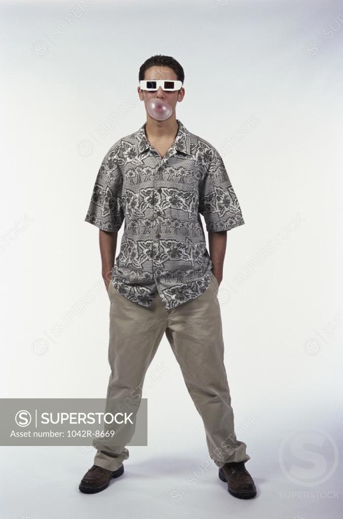 Stock Photo: 1042R-8669 Portrait of a teenage boy wearing 3-d glasses