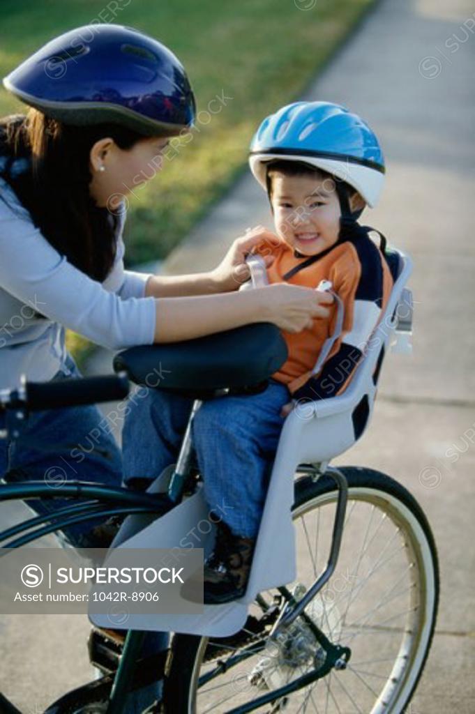 Stock Photo: 1042R-8906 Mother and son on a bicycle
