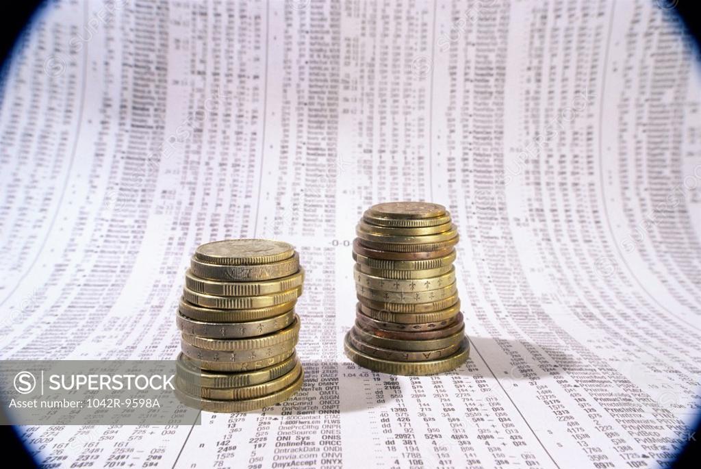 Stock Photo: 1042R-9598A Close-up of a stack of coins on financial figures
