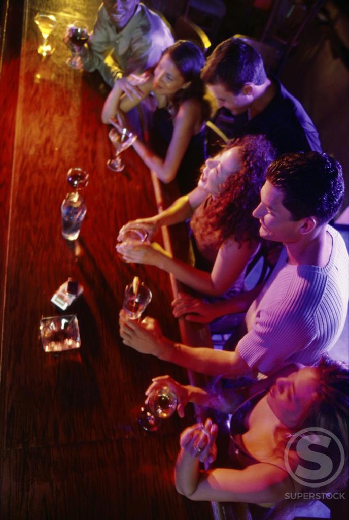 High angle view of a group of young people in a bar