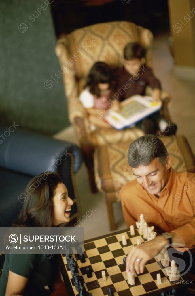 Stock Photo: 1043-103A High angle view of parents playing chess