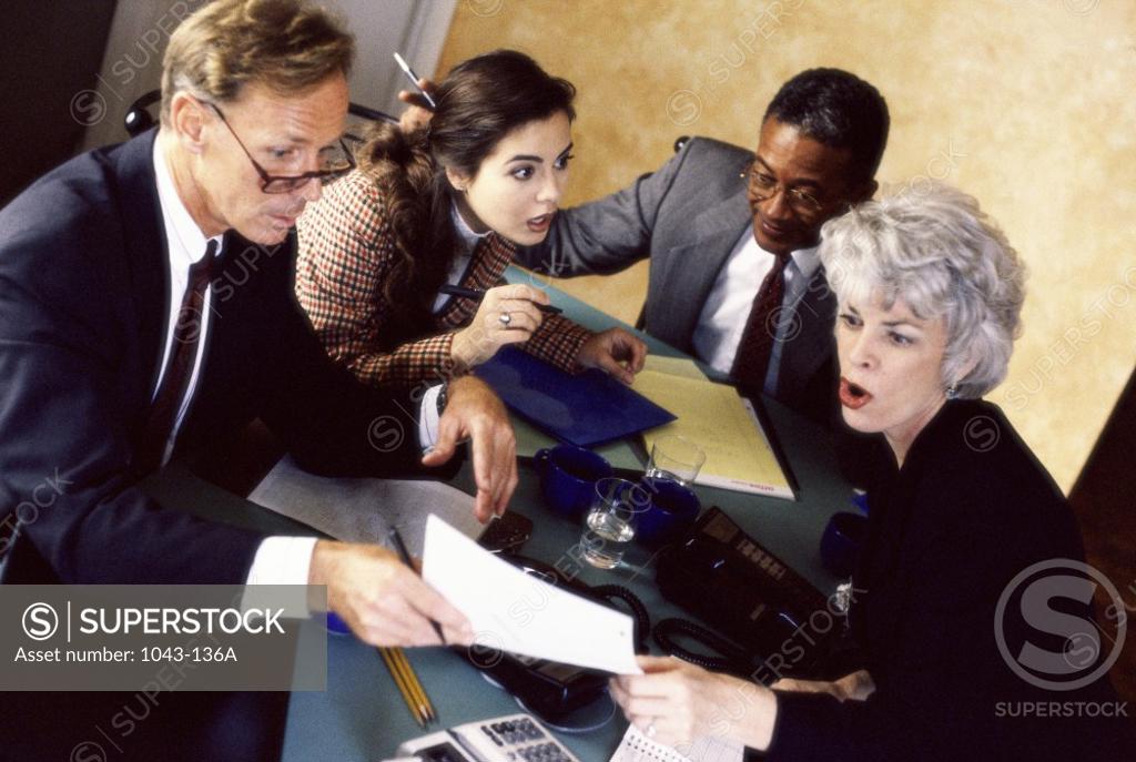 Stock Photo: 1043-136A Two businessmen and two businesswomen in an office