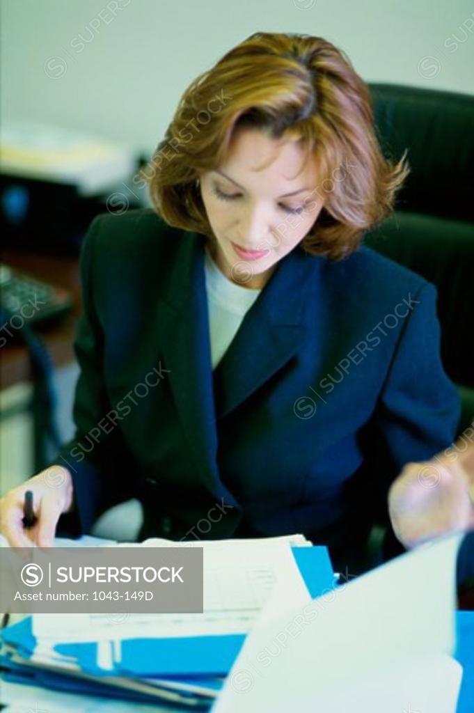 Stock Photo: 1043-149D Businesswoman working in an office