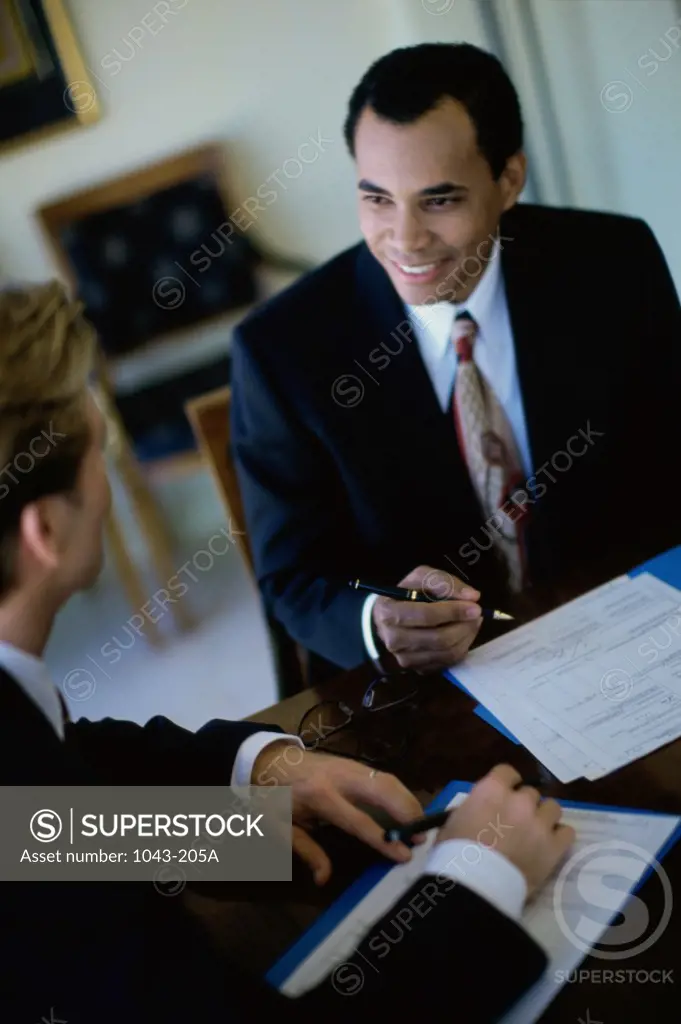 High angle view of two businessmen talking
