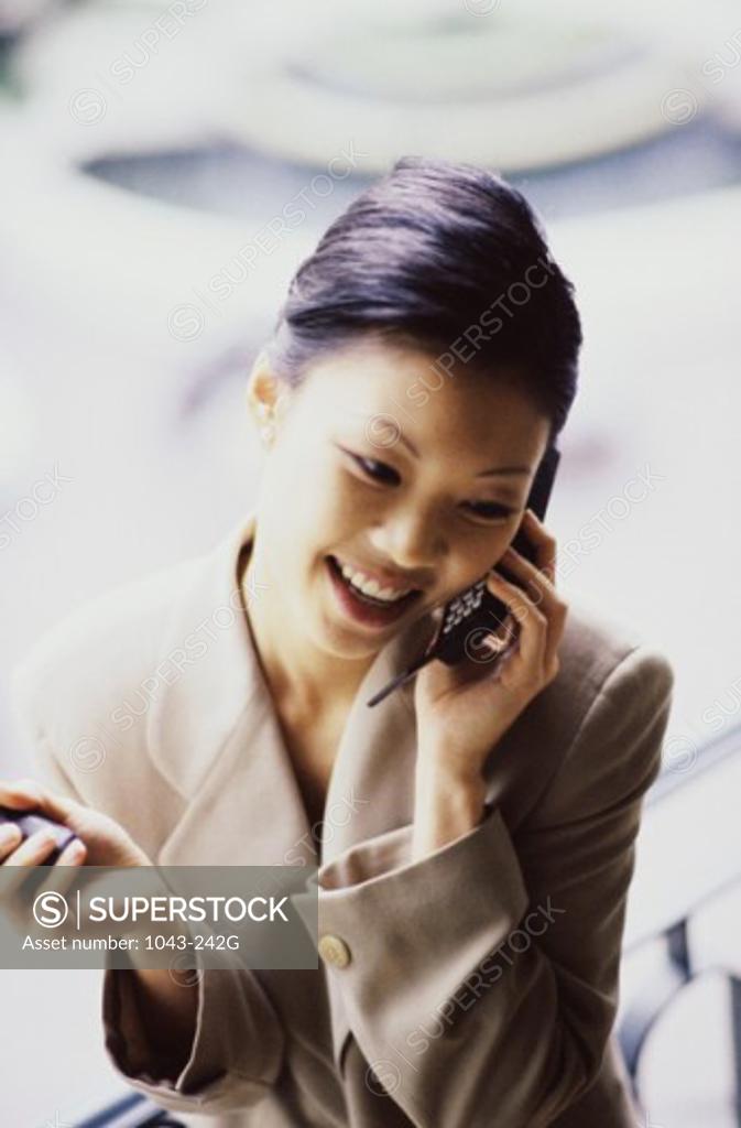 Stock Photo: 1043-242G Businesswoman talking on a mobile phone