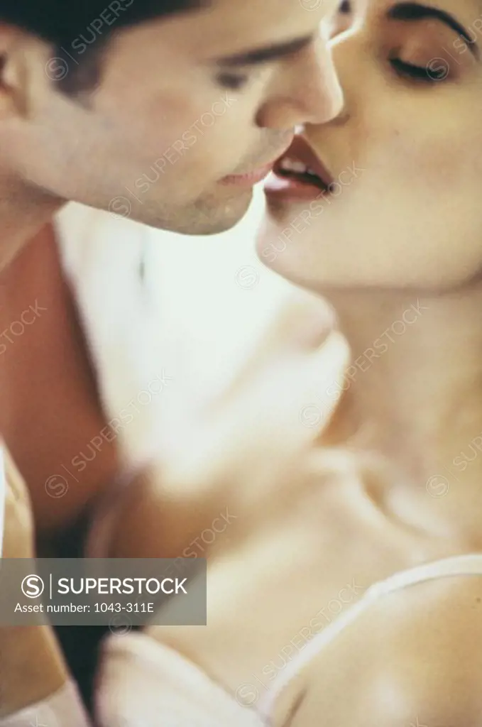 Close-up of young couple kissing