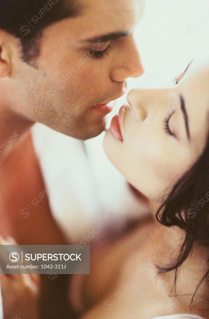 Stock Photo: 1043-311J Close-up of a young couple kissing