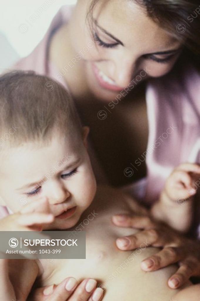 Stock Photo: 1043-399 Close-up of a mother holding her baby boy