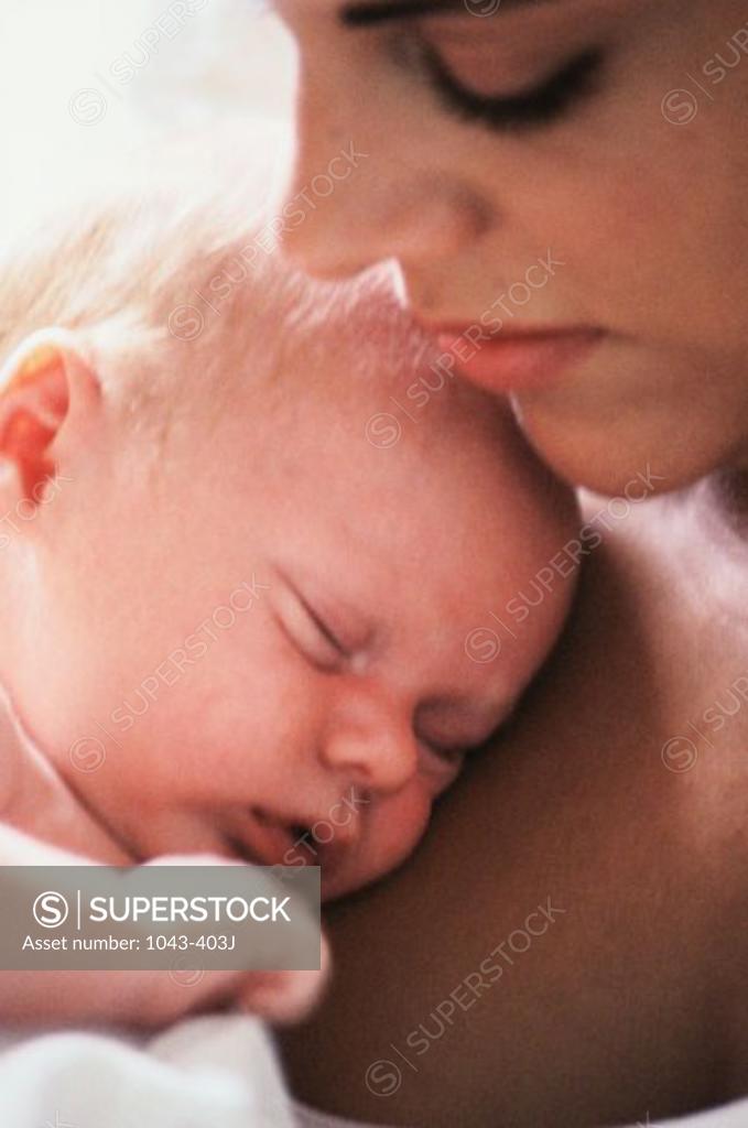 Stock Photo: 1043-403J Close-up of a mother carrying her baby boy