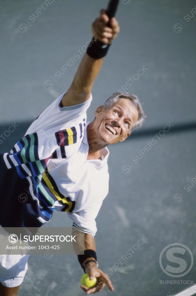 Stock Photo: 1043-425 Senior man playing tennis
