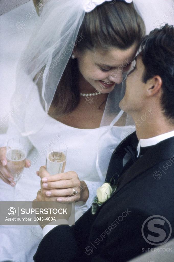 Stock Photo: 1043-488A High angle view of a newlywed couple kissing