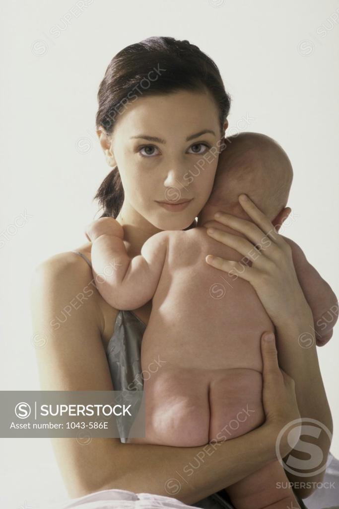 Stock Photo: 1043-586E Portrait of a mother hugging her baby boy