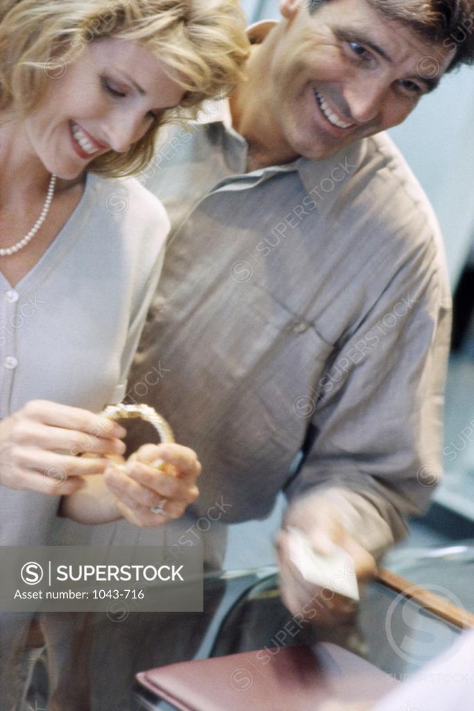Stock Photo: 1043-716 Mid adult couple in a jewelry store