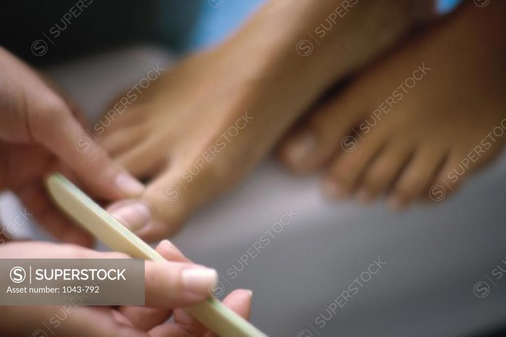 Stock Photo: 1043-792 Young woman getting a pedicure
