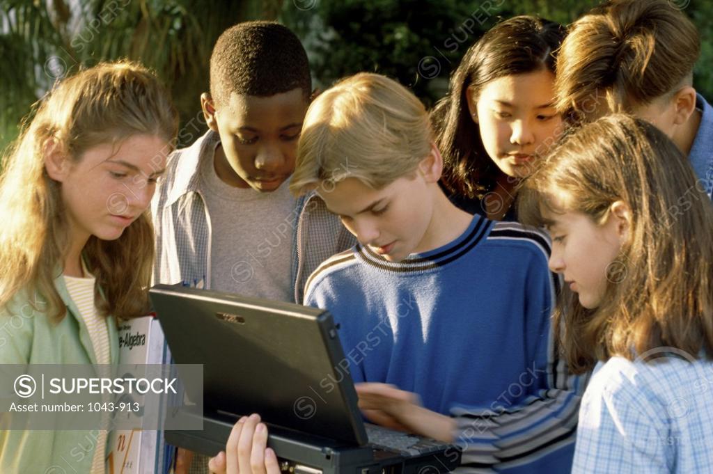 Stock Photo: 1043-913 Teenage boy using a laptop