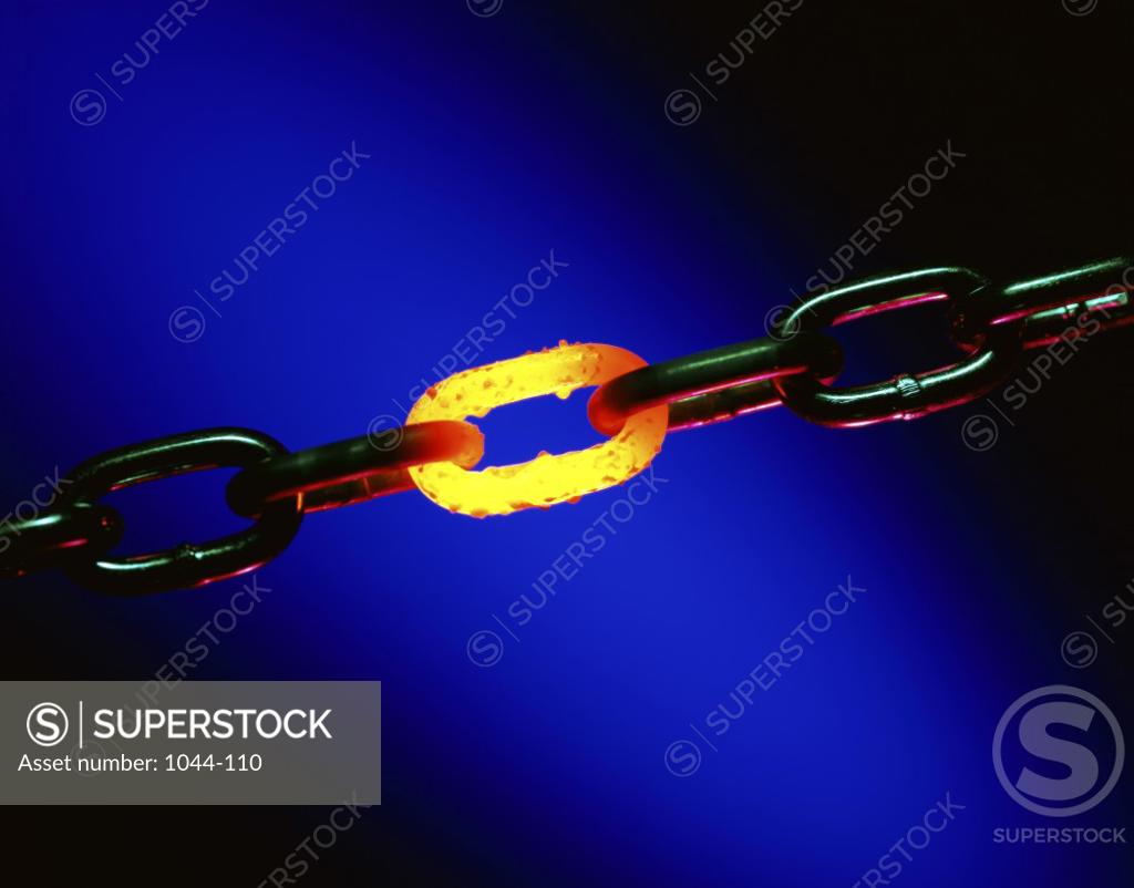 Stock Photo: 1044-110 Close-up of a glowing link of a chain