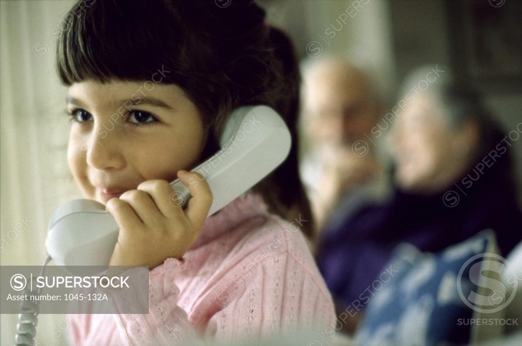 Stock Photo: 1045-132A Girl talking on a telephone