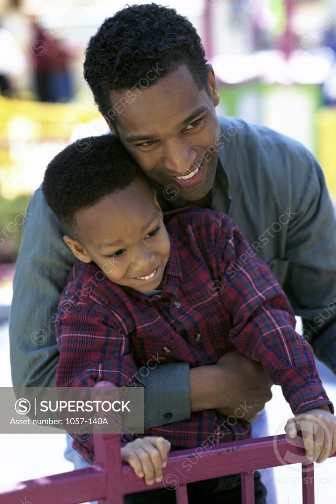 Stock Photo: 1057-140A Father carrying his son