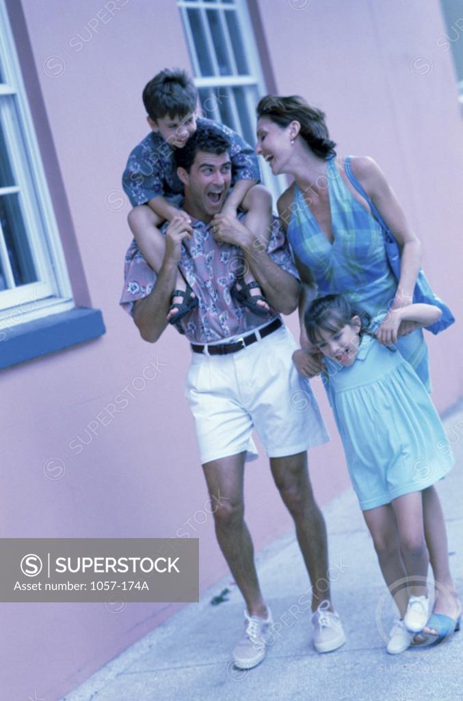 Stock Photo: 1057-174A Parents walking with their son and daughter