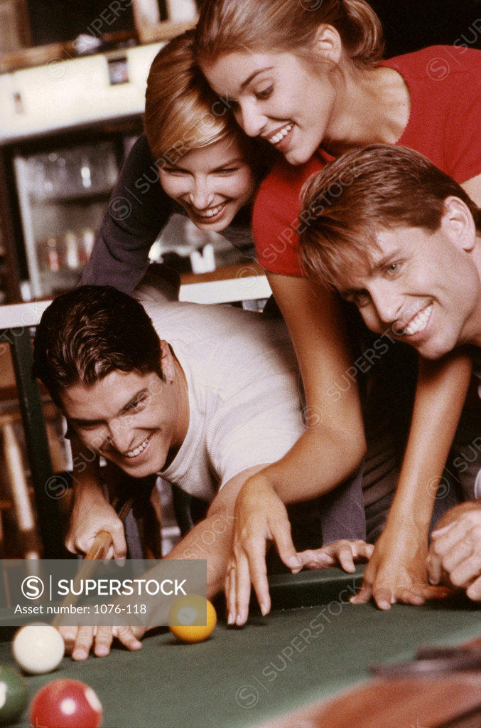Stock Photo: 1076-118 Two young couples playing pool