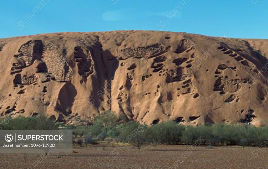 Stock Photo: 1096-1092D Rock formation on a landscape, Ayers Rock, Uluru-Kata Tjuta National Park, Northern Territory, Australia