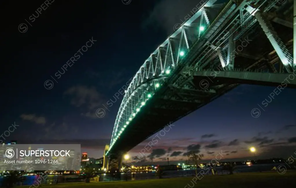 Low angle view of a bridge lit up at night, Sydney Harbor Bridge, Sydney, New South Wales, Australia