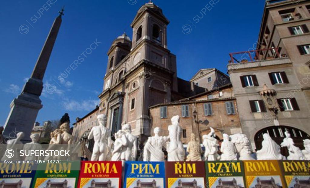 Stock Photo: 1096-1427C Low angle view of an obelisk with statues in front of a church, Trinita dei Monti, Rome, Italy