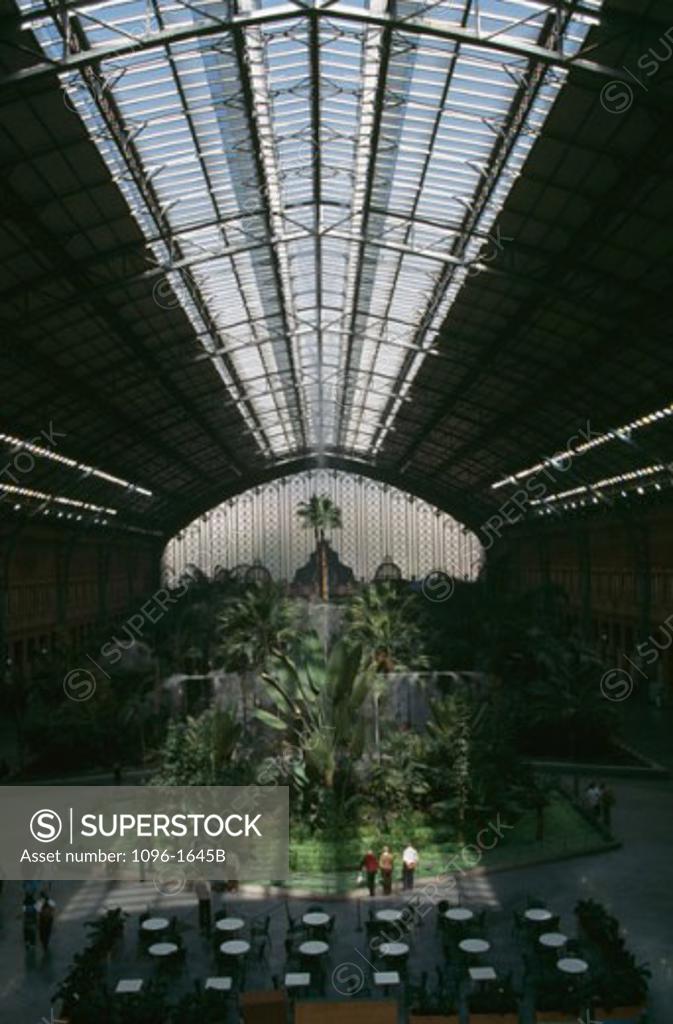 Stock Photo: 1096-1645B High angle view of a group of people in a train station, Atocha Station, Madrid, Spain