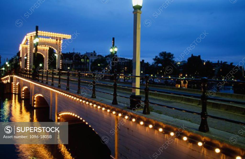 Stock Photo: 1096-1805B Drawbridge lit up at night, Magere Brug, Amsterdam, Netherlands