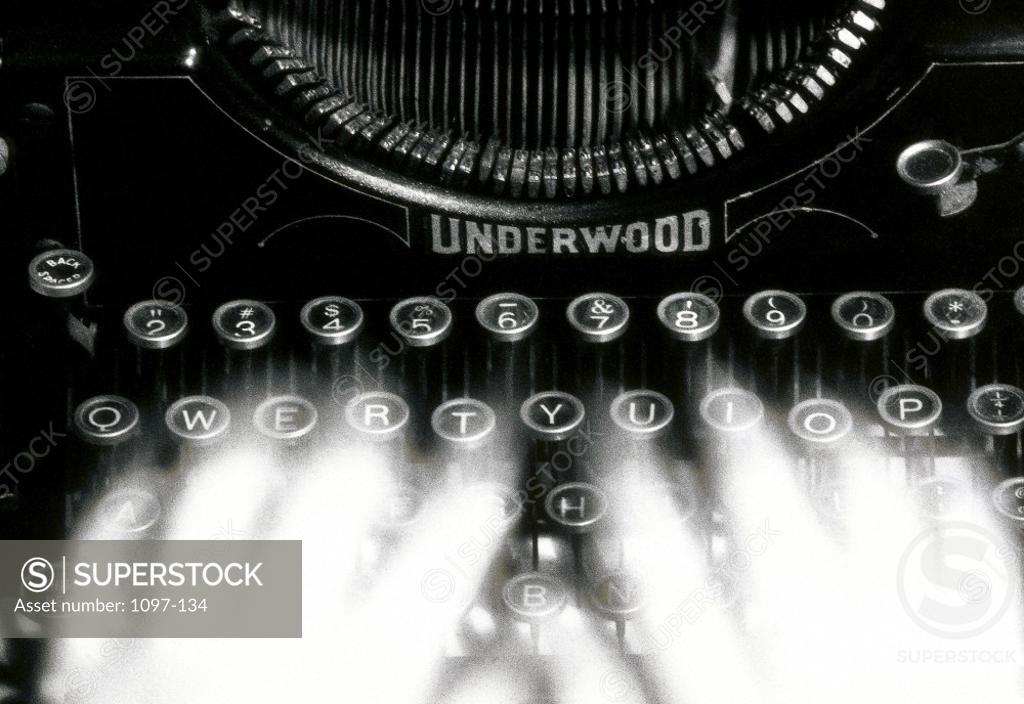 Stock Photo: 1097-134 Close-up of a person's hands typing on a typewriter