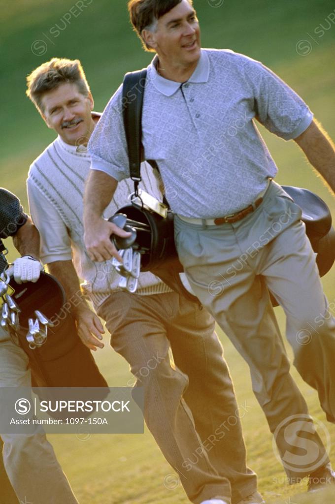 Stock Photo: 1097-150A Three men walking on a golf course