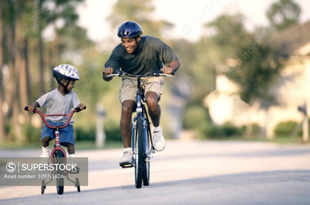 Stock Photo: 1097-382A Father and his son cycling