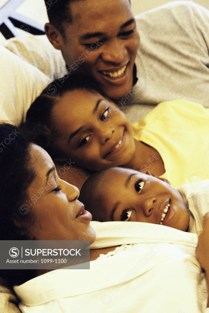 Stock Photo: 1099-1100 Close-up of a family smiling