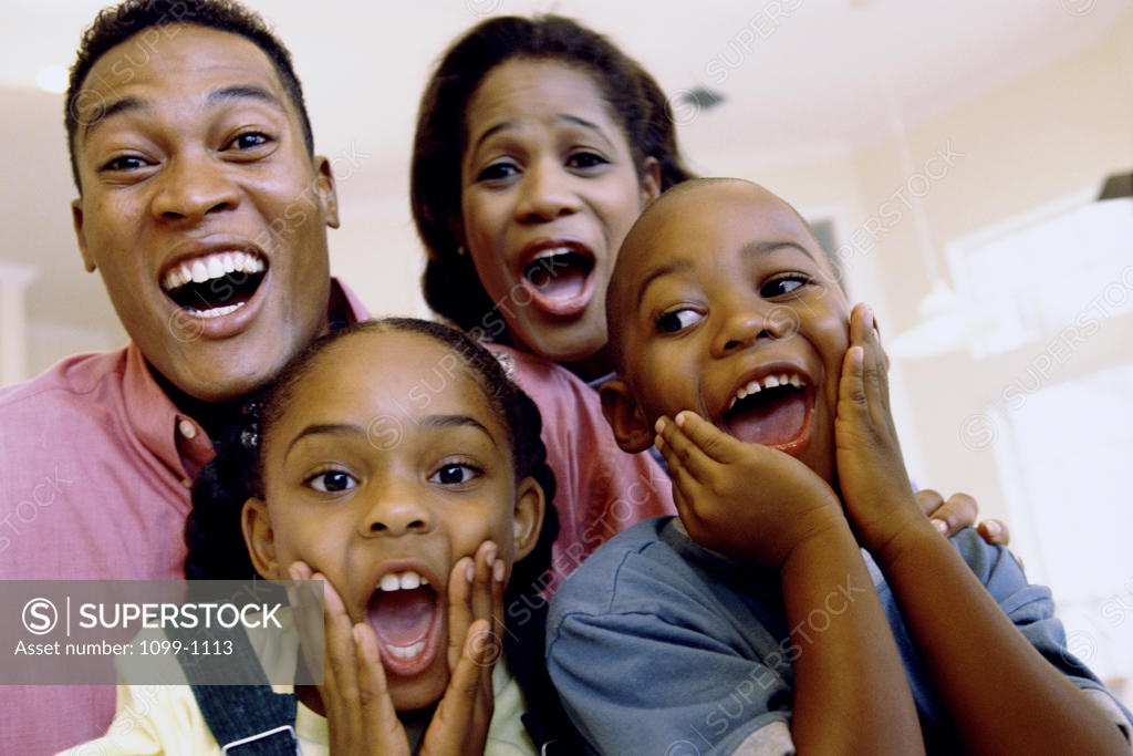 Stock Photo: 1099-1113 Portrait of parents and their son and daughter laughing