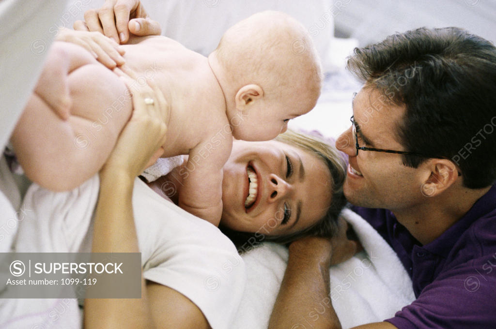 Stock Photo: 1099-119 Parents playing with their baby boy