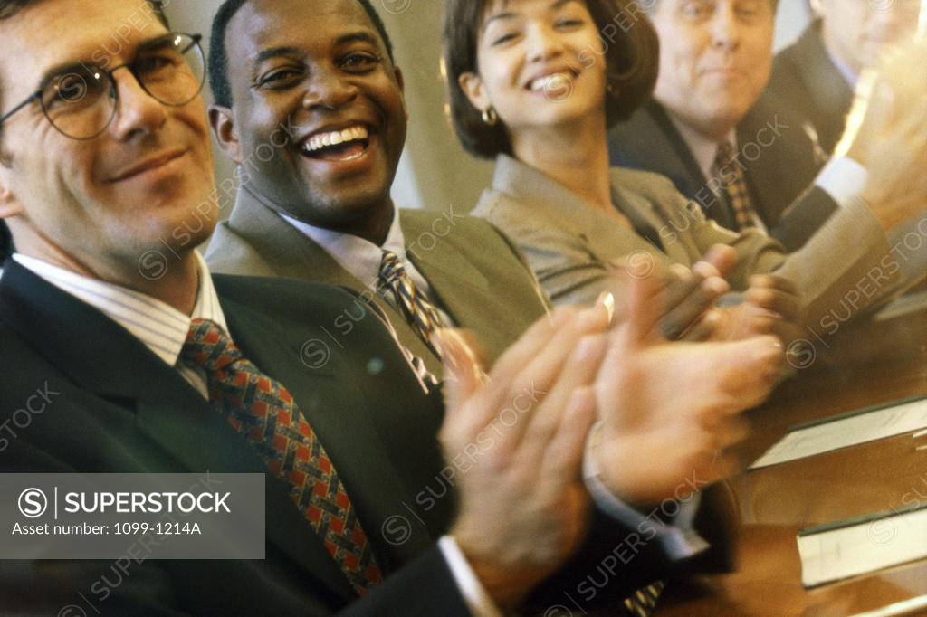 Stock Photo: 1099-1214A Portrait of a group of business executives applauding