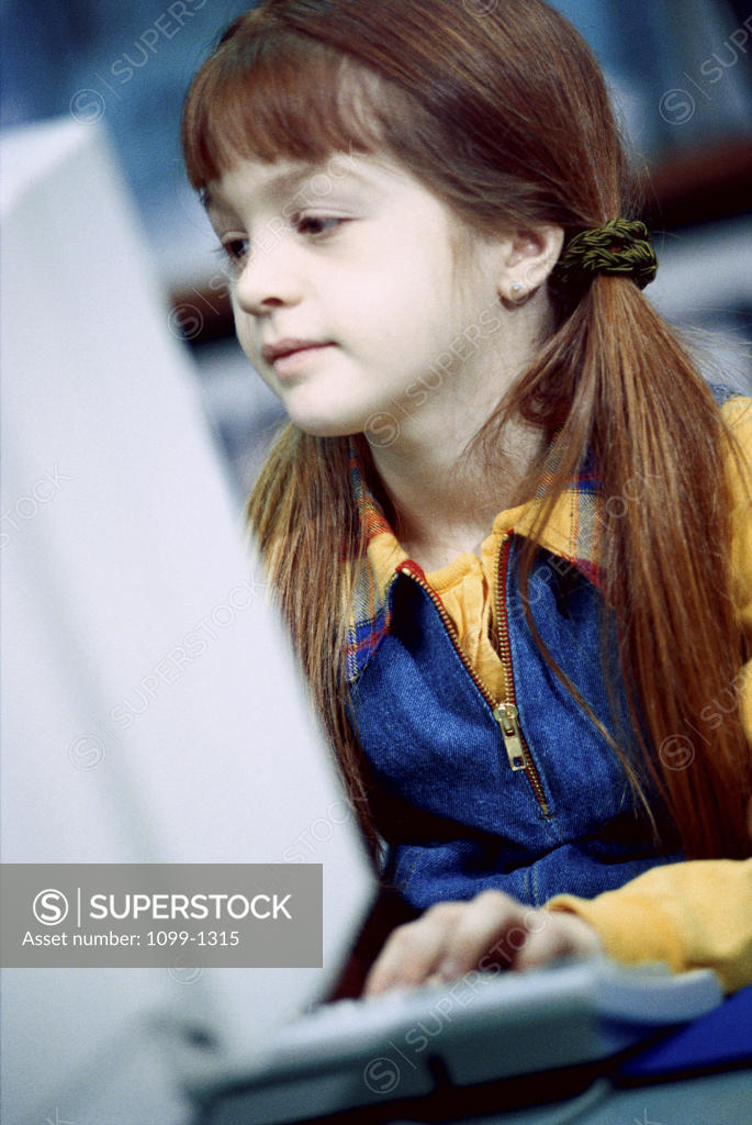 Stock Photo: 1099-1315 Girl in front of a computer